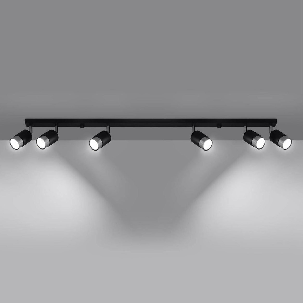 Minimalist six-light black track lighting fixture, designed for ceiling installation to provide adjustable, focused illumination for modern interiors