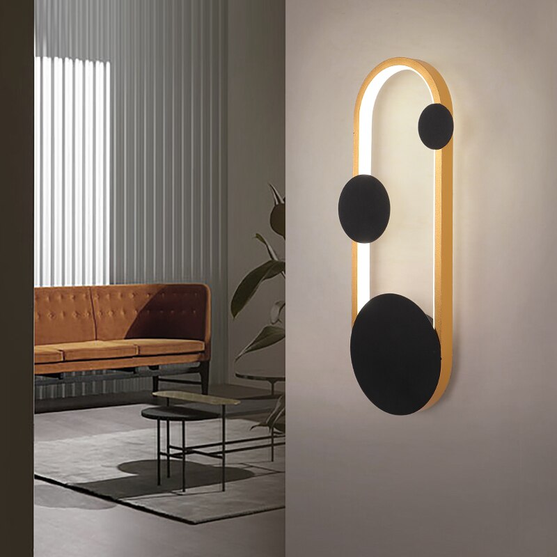 Sodewise view of Oval Gold Dreake Modern Wall Sconce Light placed on the white wall