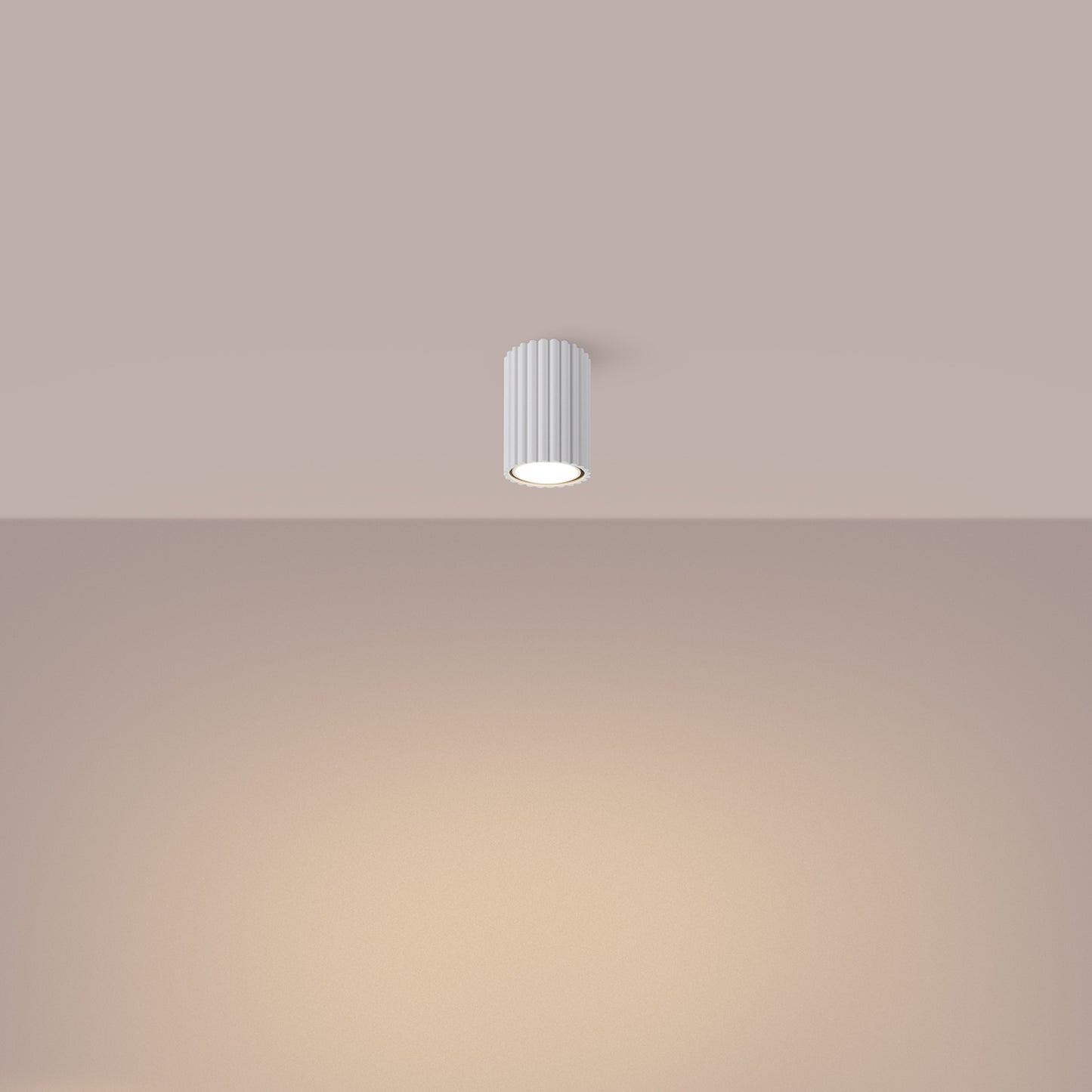 White Ribbed Surface Spotlight switched on in modern UK home interior, warm LED glow