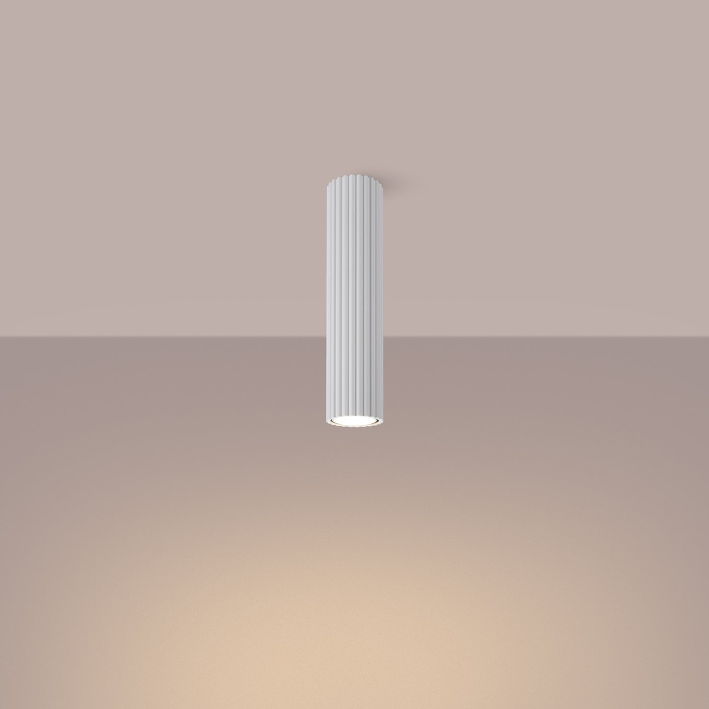 White Tall Ribbed Cylinder Ceiling Spotlight switched on in modern UK home interior, warm LED glow