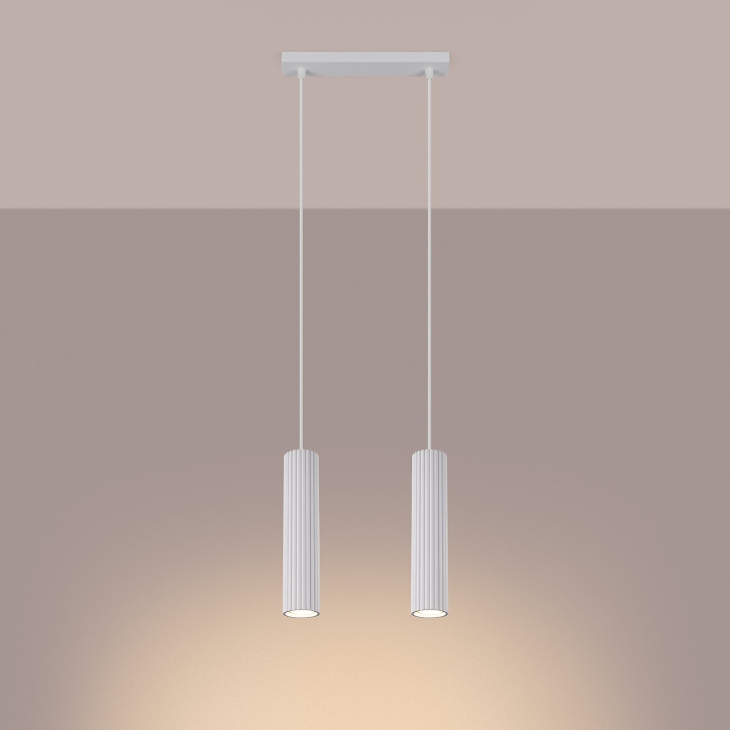 White Twin Ribbed Pendant Spotlight switched on in modern UK home interior, warm LED glow