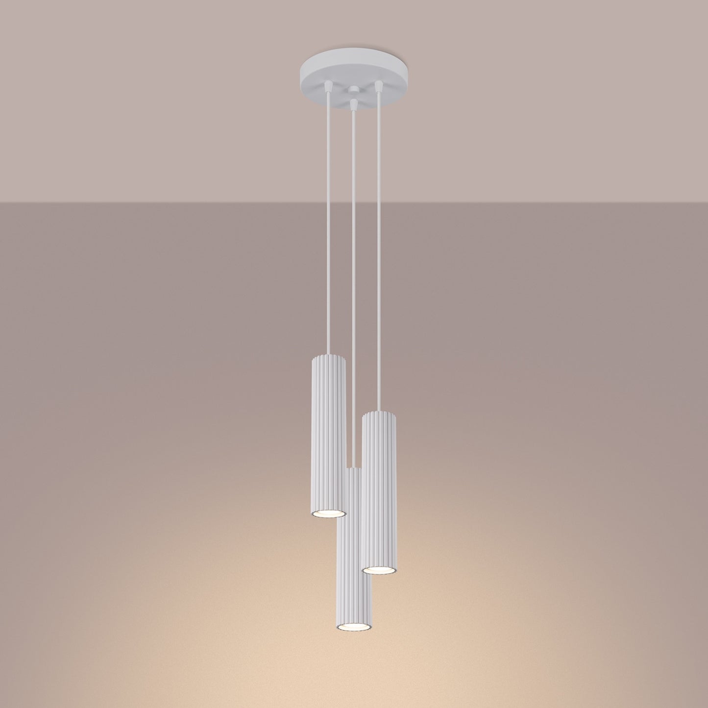 White Triple Ribbed Pendant Cluster switched on in modern UK home interior, warm LED glow