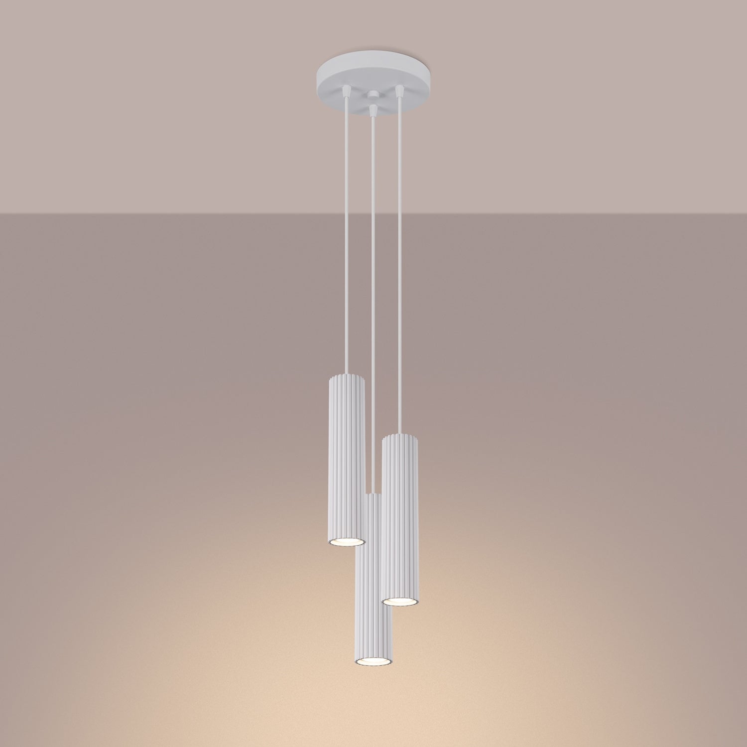 White Triple Ribbed Pendant Cluster switched on in modern UK home interior, warm LED glow