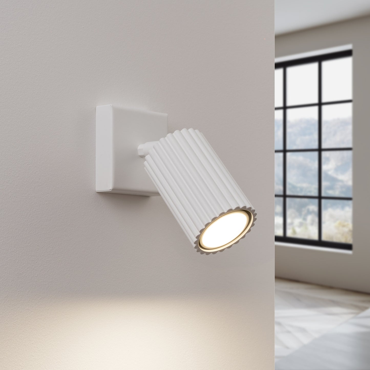 White Ribbed Tube Wall Light switched on in modern UK home interior, warm LED glow