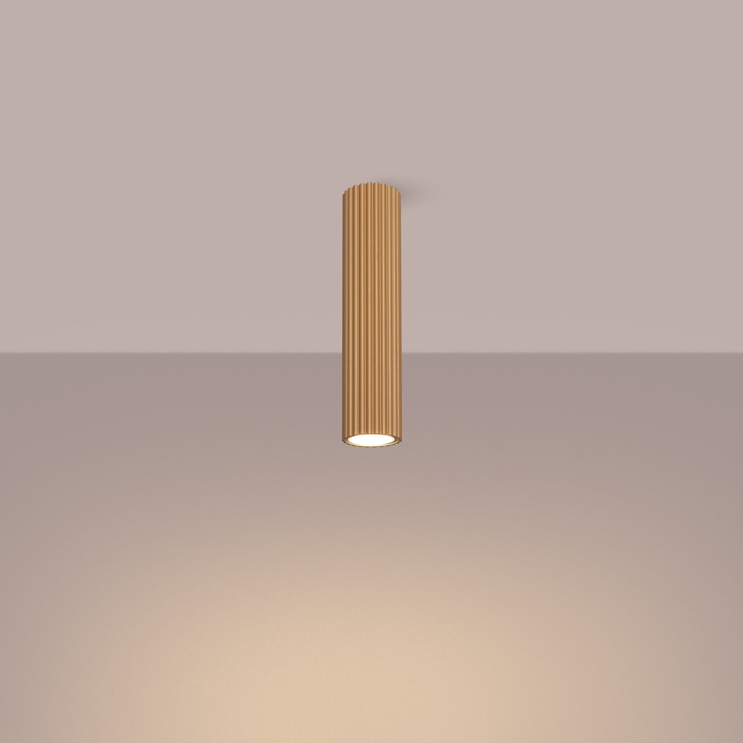 Gold Tall Ribbed Cylinder Ceiling Spotlight switched on in modern UK home interior, warm LED glow