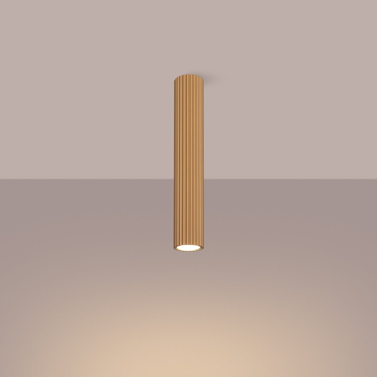 Gold Extra Tall Ribbed Cylinder Ceiling Light switched on in modern UK home interior, warm LED glow