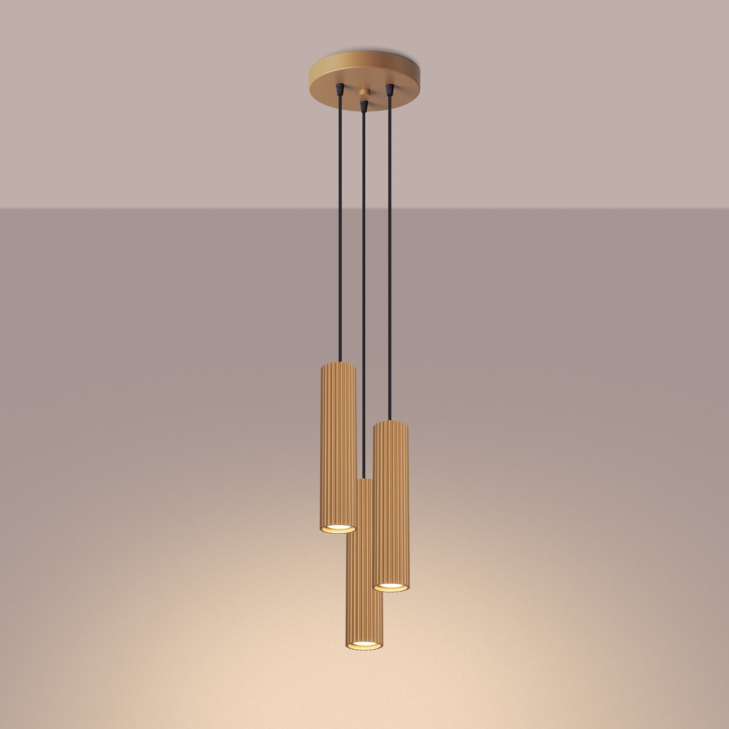 Gold Triple Ribbed Pendant Cluster switched on in modern UK home interior, warm LED glow