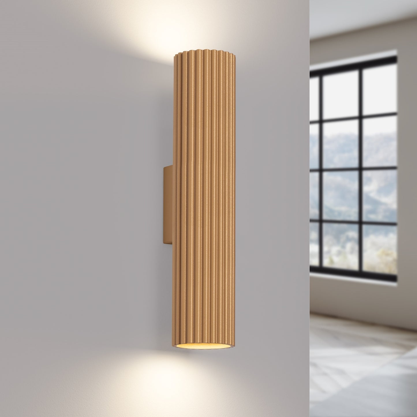 Gold Twin Ribbed Wall Light Up Down switched on in modern UK home interior, warm LED glow