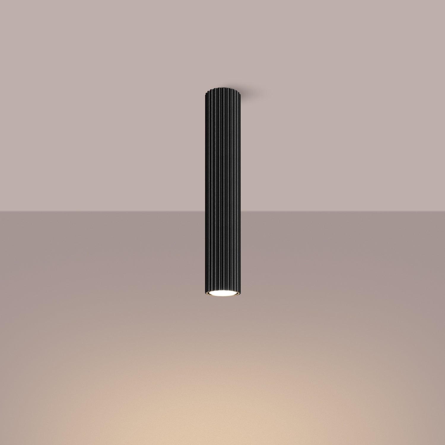 Black Extra Tall Ribbed Cylinder Ceiling Light switched on in modern UK home interior, warm LED glow