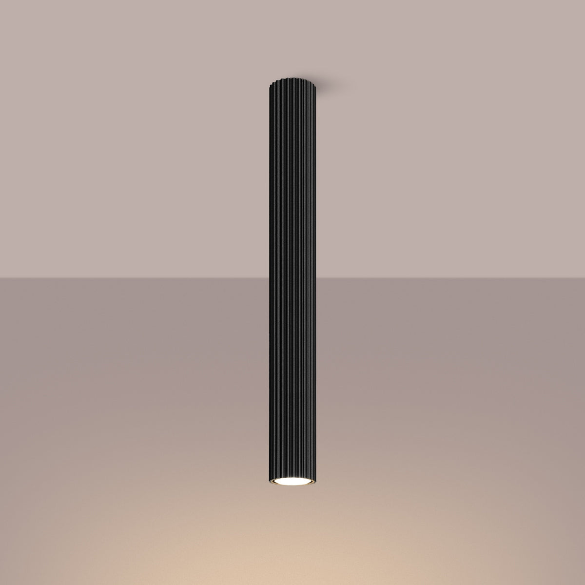 Black Pillar Ribbed Cylinder Ceiling Light 60cm switched on in modern UK home interior, warm LED glow