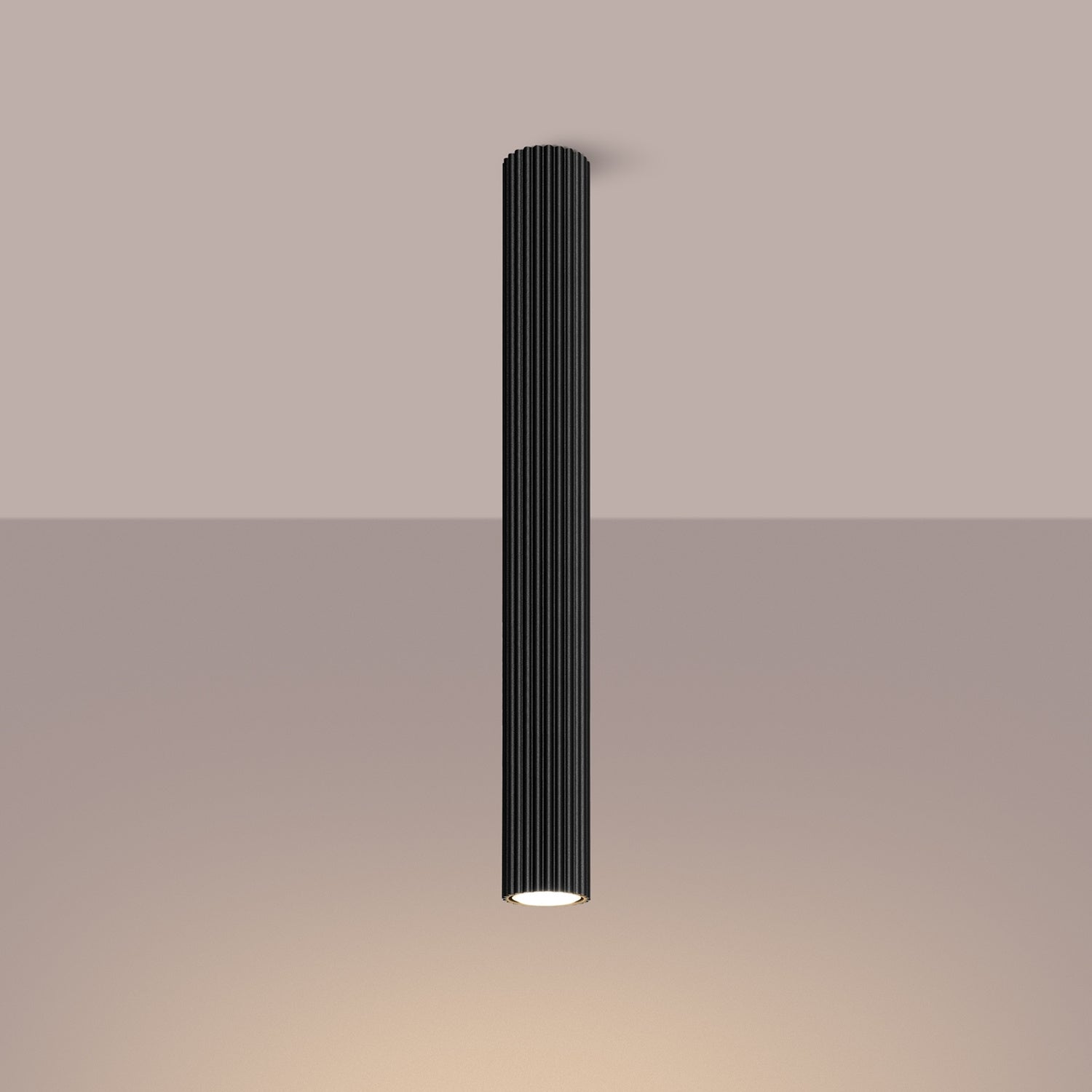 Black Pillar Ribbed Cylinder Ceiling Light 60cm switched on in modern UK home interior, warm LED glow
