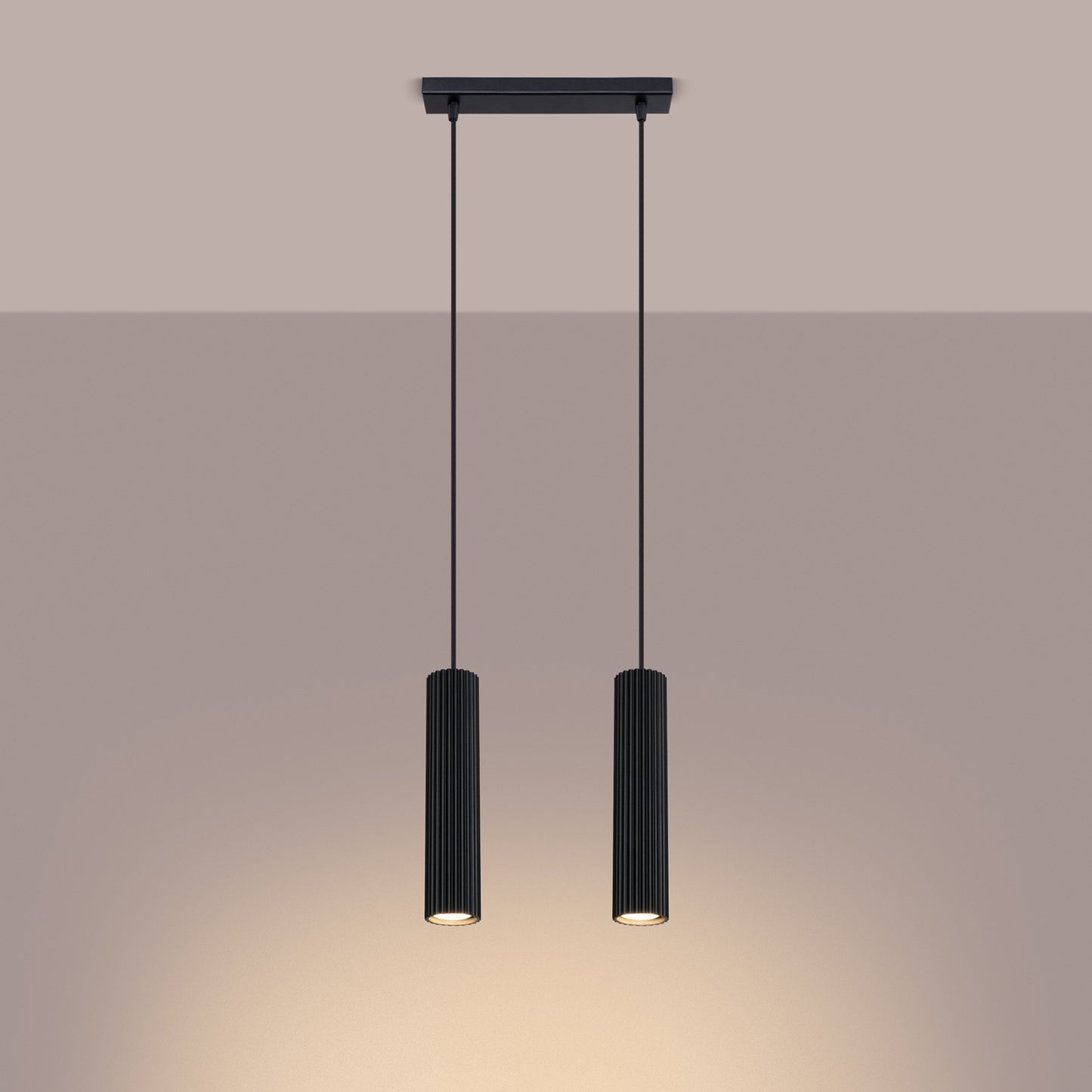 Black Twin Ribbed Pendant Spotlight switched on in modern UK home interior, warm LED glow