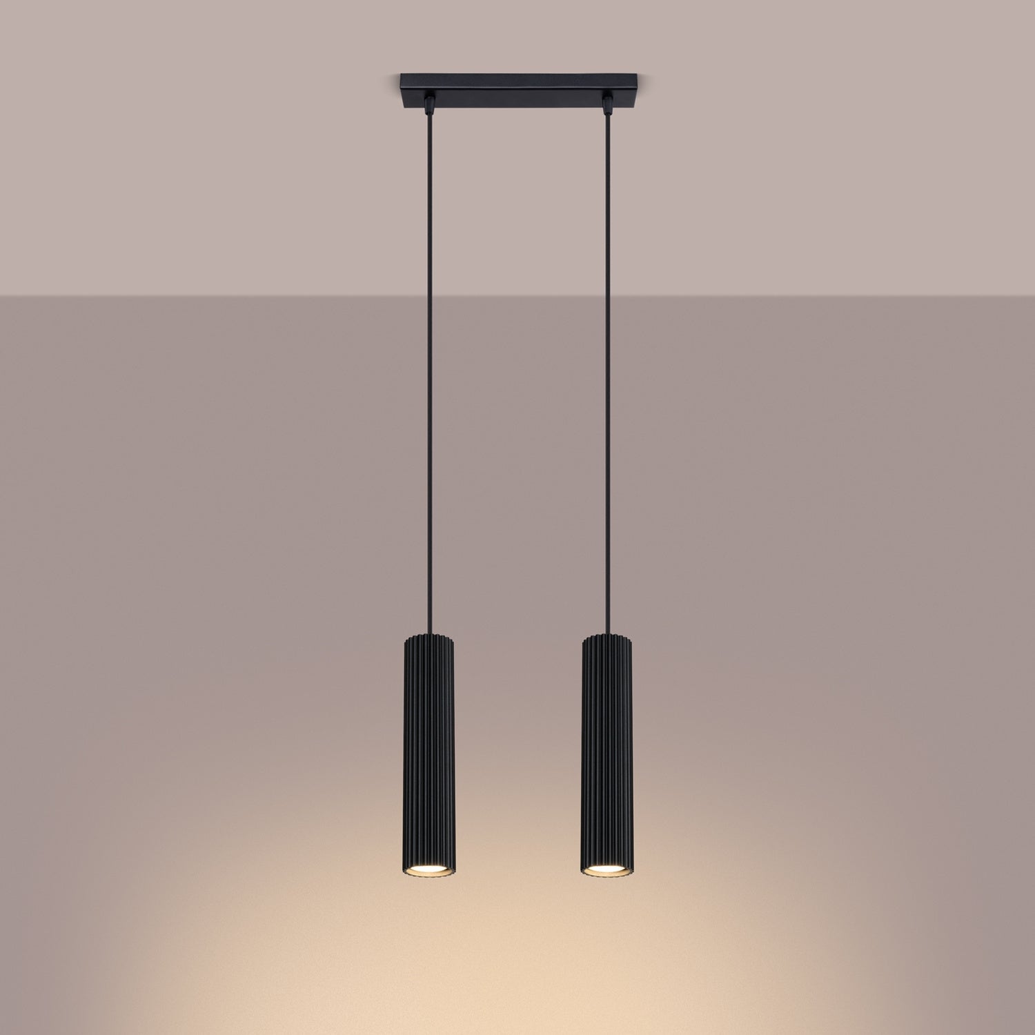 Black Twin Ribbed Pendant Spotlight switched on in modern UK home interior, warm LED glow