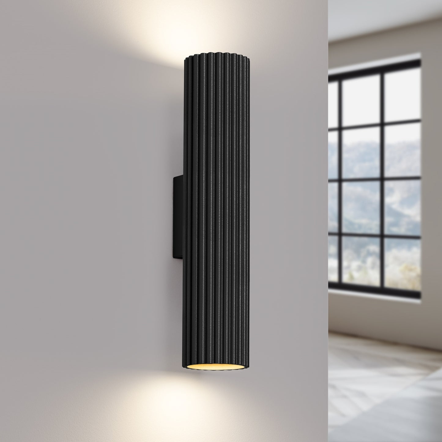 Black Twin Ribbed Wall Light Up Down switched on in modern UK home interior, warm LED glow