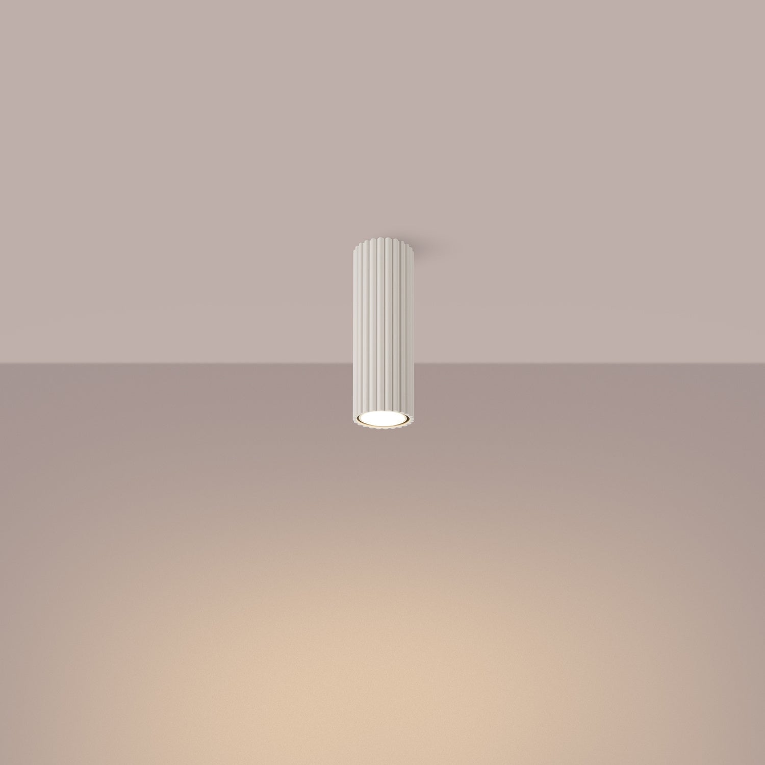 Beige Ribbed Tube Ceiling Spotlight 20cm switched on in modern UK home interior, warm LED glow
