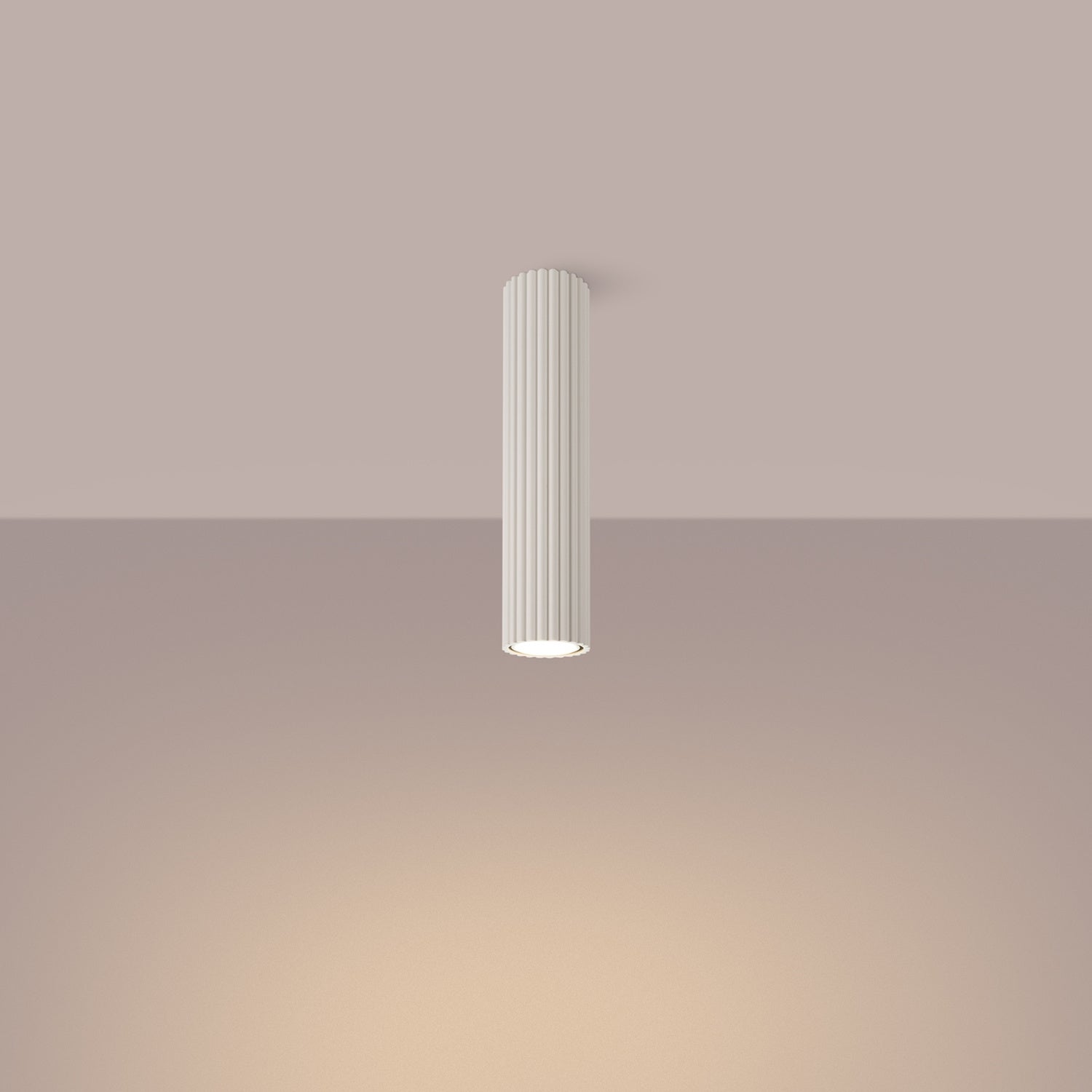 Beige Tall Ribbed Cylinder Ceiling Spotlight switched on in modern UK home interior, warm LED glow