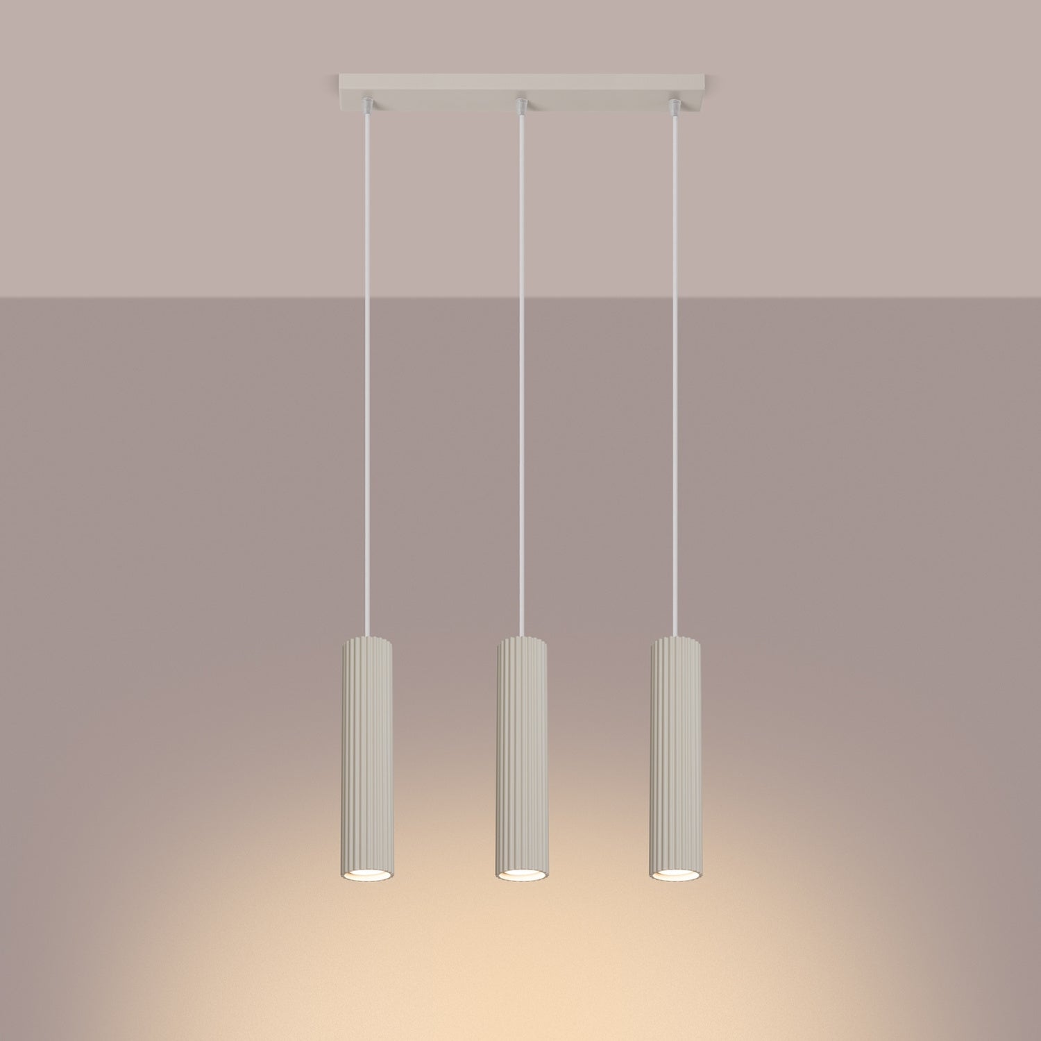 Beige Triple Ribbed Pendant Bar switched on in modern UK home interior, warm LED glow