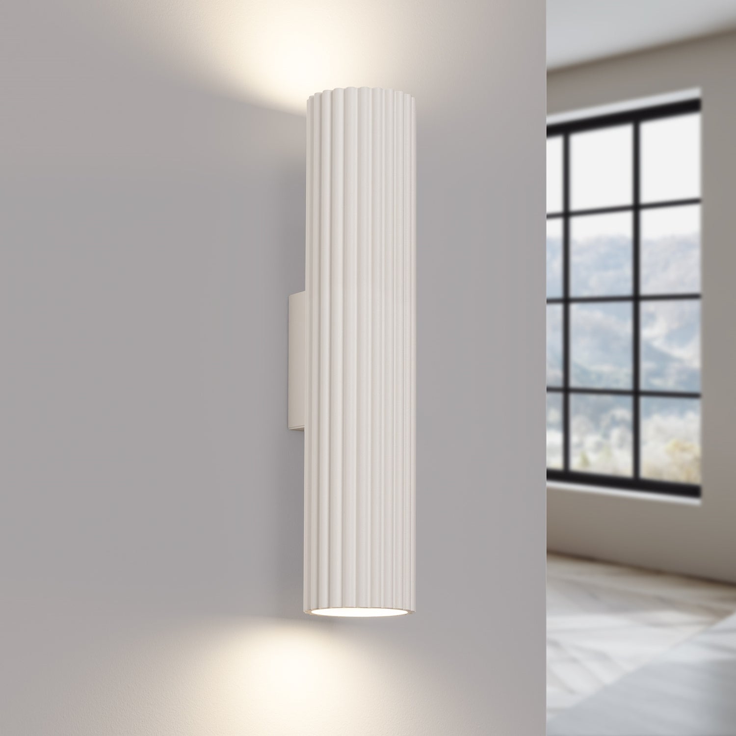 Beige Twin Ribbed Wall Light Up Down switched on in modern UK home interior, warm LED glow
