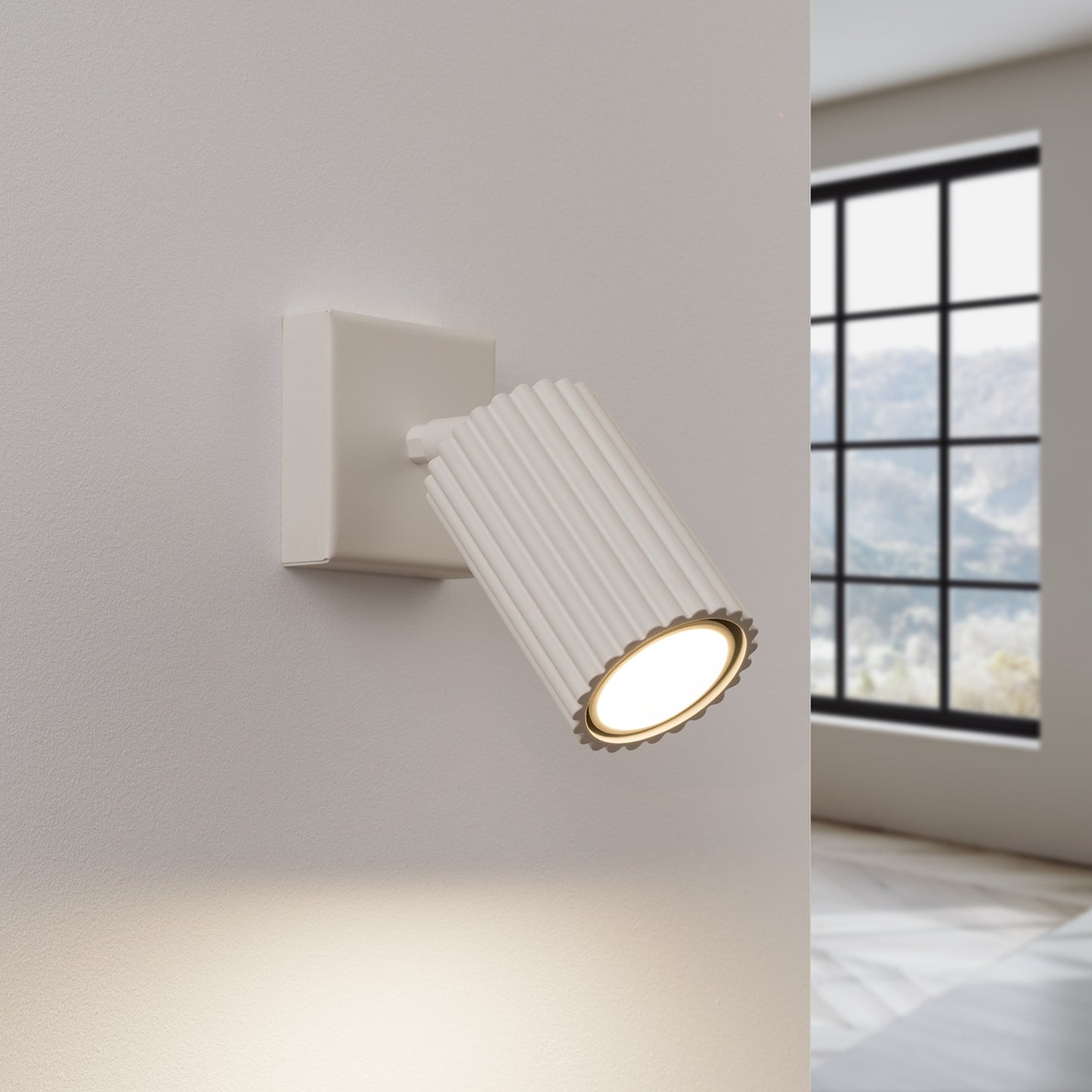 Beige Ribbed Tube Wall Light switched on in modern UK home interior, warm LED glow