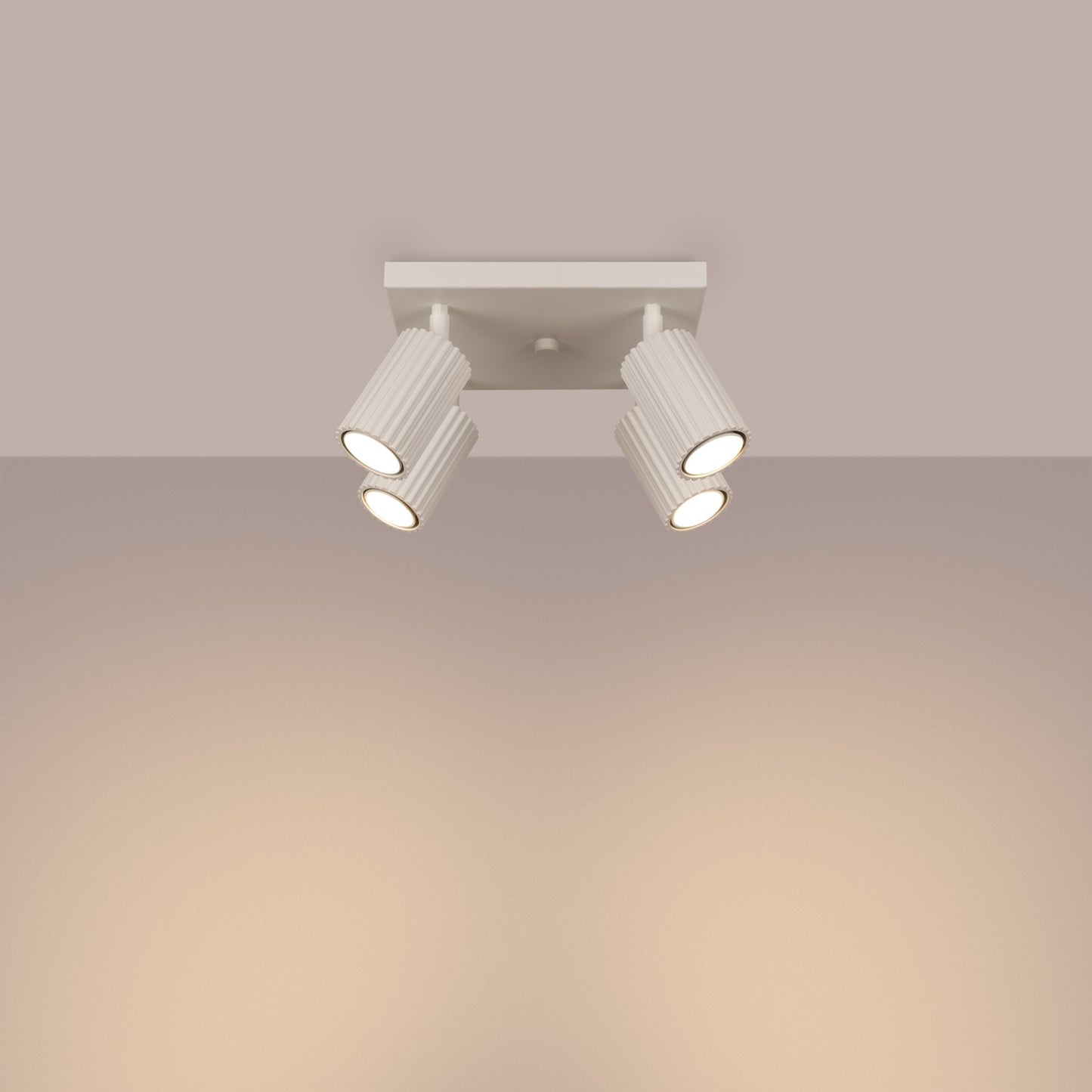 Beige Quad Ribbed Spotlight Cluster switched on in modern UK home interior, warm LED glow