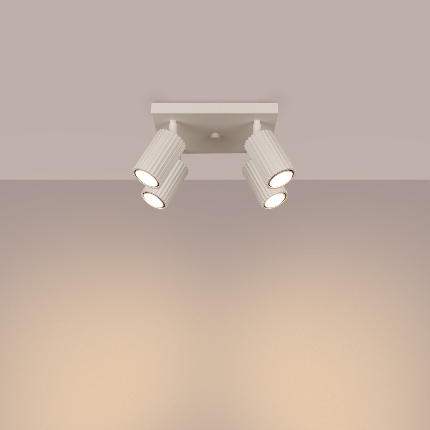 Beige Quad Ribbed Spotlight Cluster switched on in modern UK home interior, warm LED glow