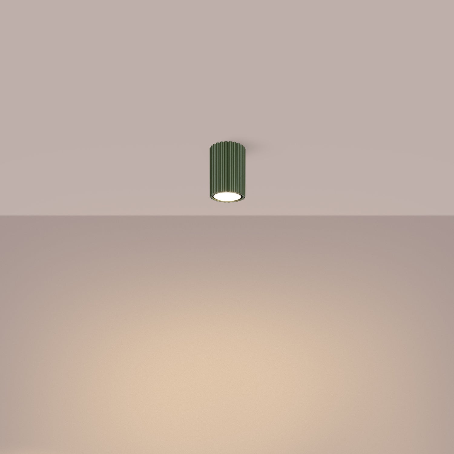 Olive Green Ribbed Surface Spotlight switched on in modern UK home interior, warm LED glow