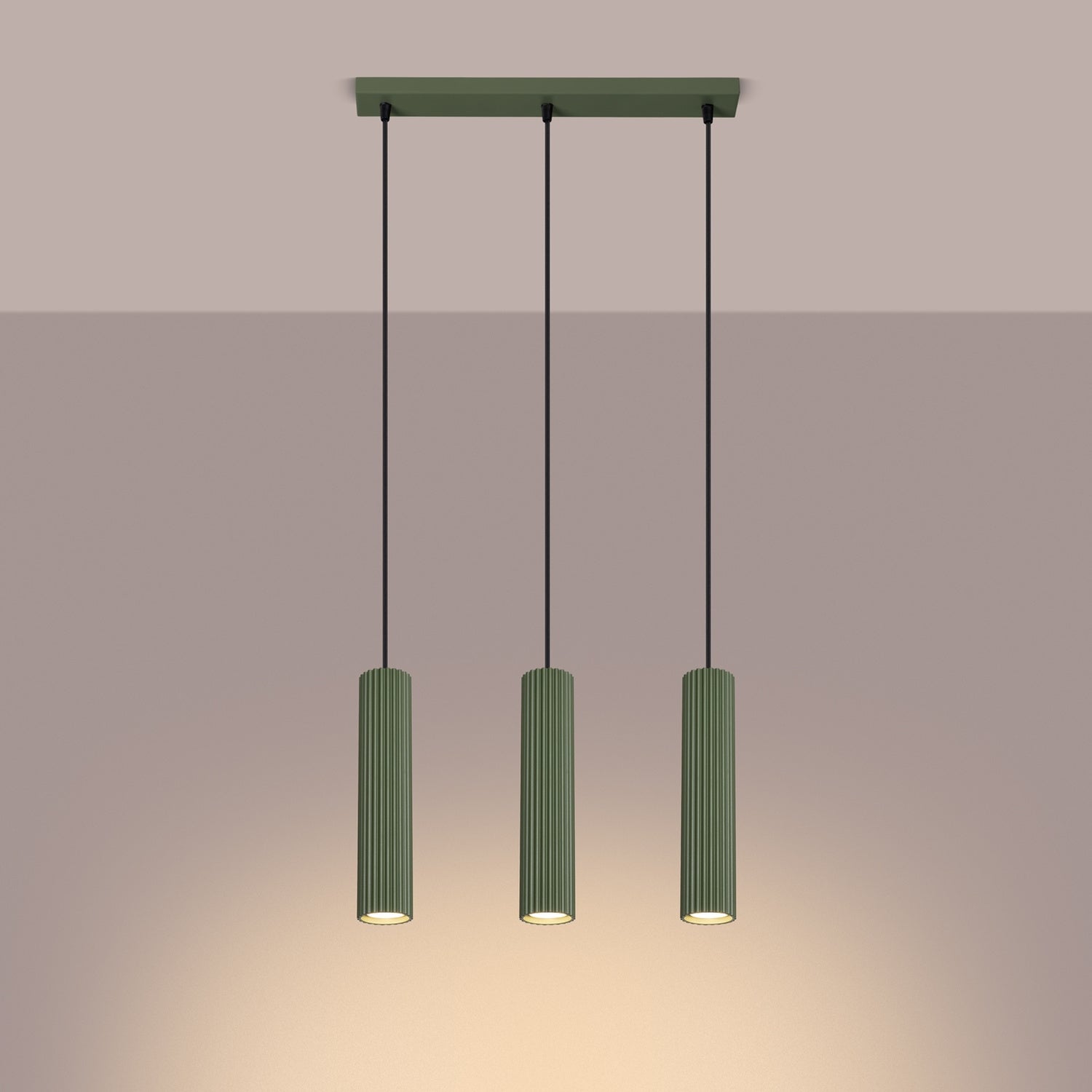 Olive Green Triple Ribbed Pendant Bar switched on in modern UK home interior, warm LED glow