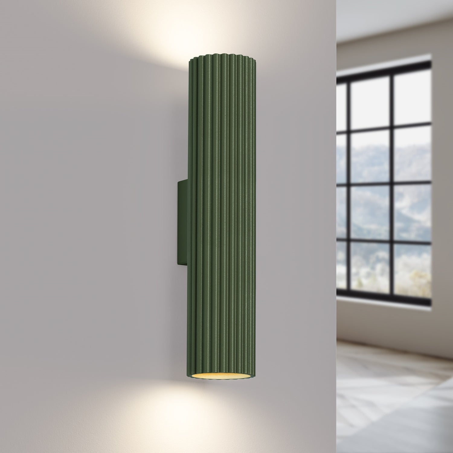 Olive Green Twin Ribbed Wall Light Up Down switched on in modern UK home interior, warm LED glow