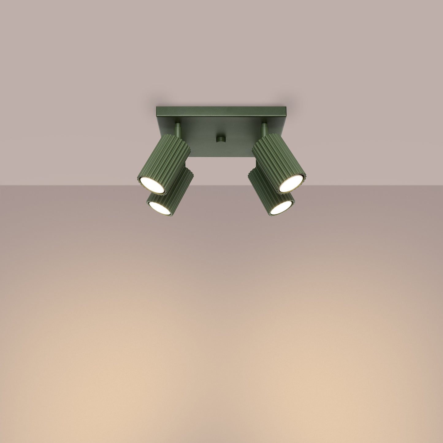 Olive Green Quad Ribbed Spotlight Cluster switched on in modern UK home interior, warm LED glow