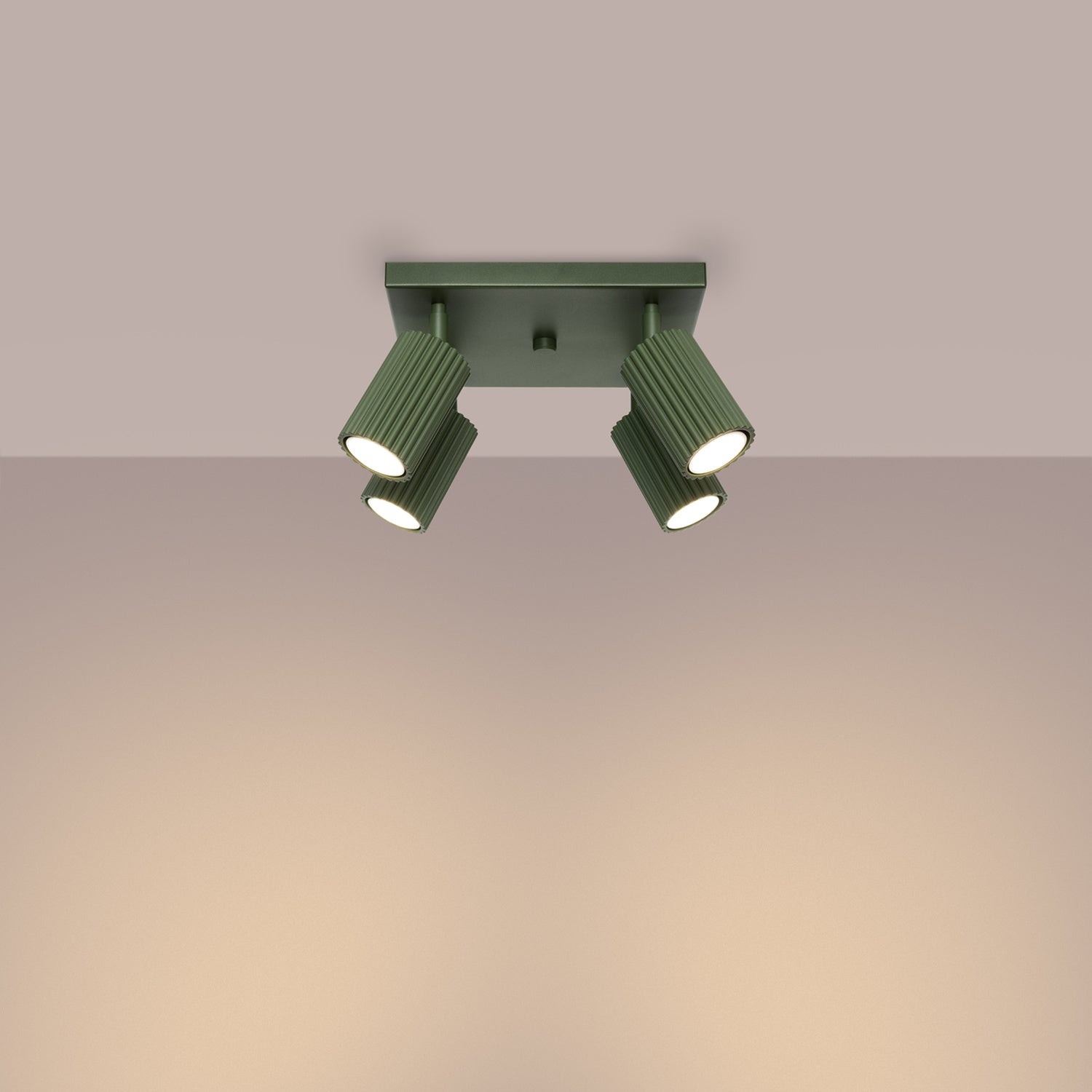 Olive Green Quad Ribbed Spotlight Cluster switched on in modern UK home interior, warm LED glow