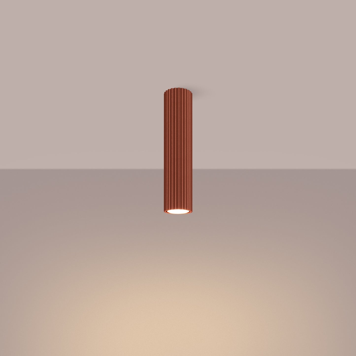 Red Ochre Tall Ribbed Cylinder Ceiling Spotlight switched on in modern UK home interior, warm LED glow