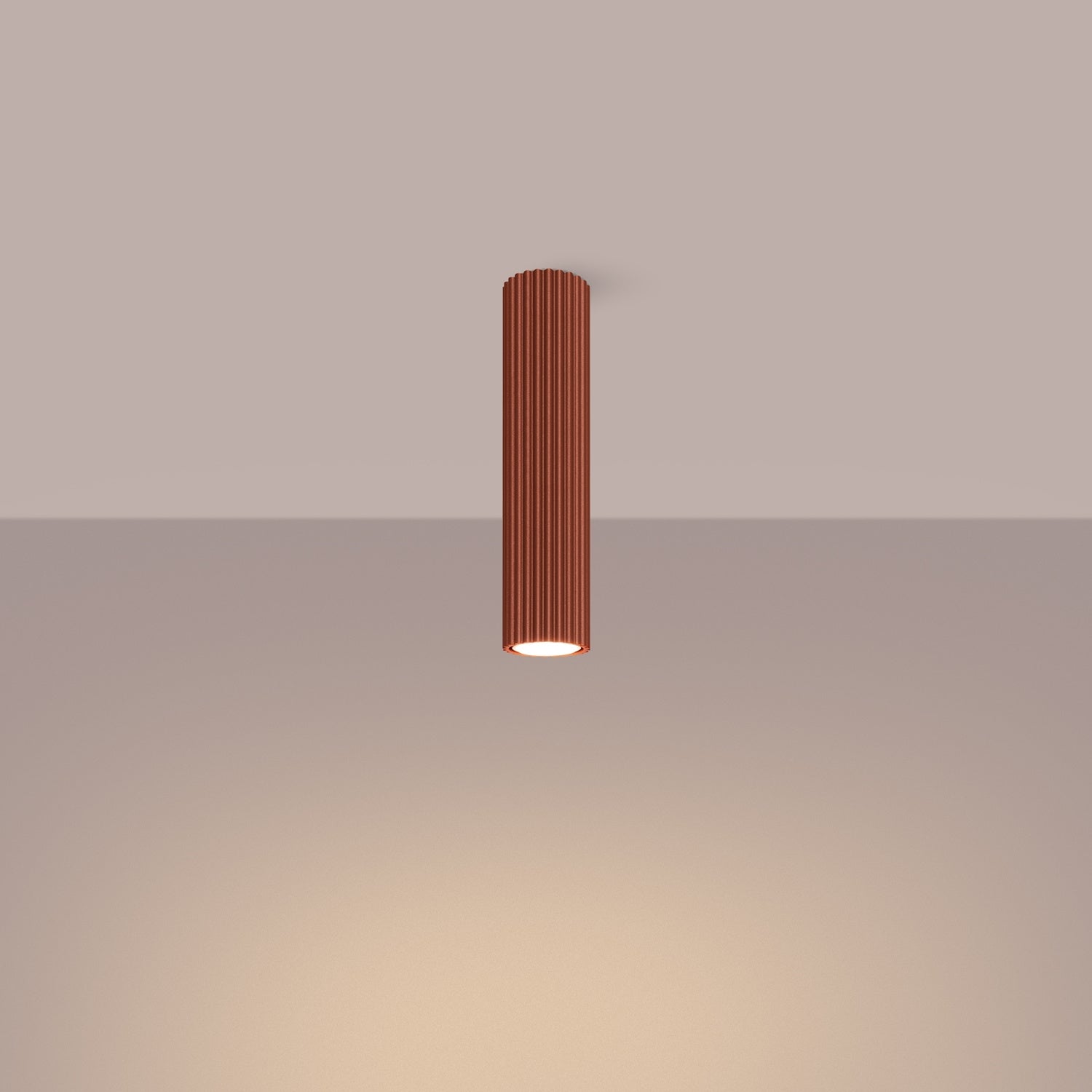 Red Ochre Tall Ribbed Cylinder Ceiling Spotlight switched on in modern UK home interior, warm LED glow