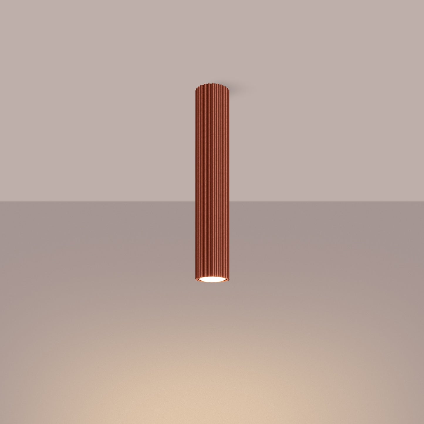 Red Ochre Extra Tall Ribbed Cylinder Ceiling Light switched on in modern UK home interior, warm LED glow