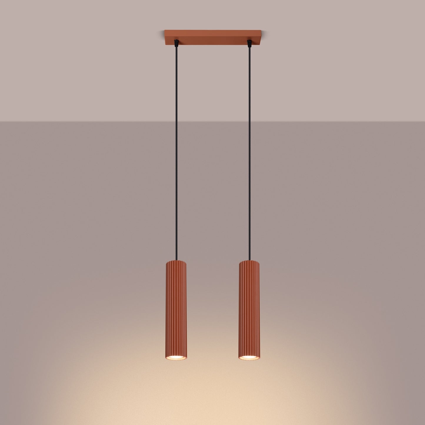 Red Ochre Twin Ribbed Pendant Spotlight switched on in modern UK home interior, warm LED glow