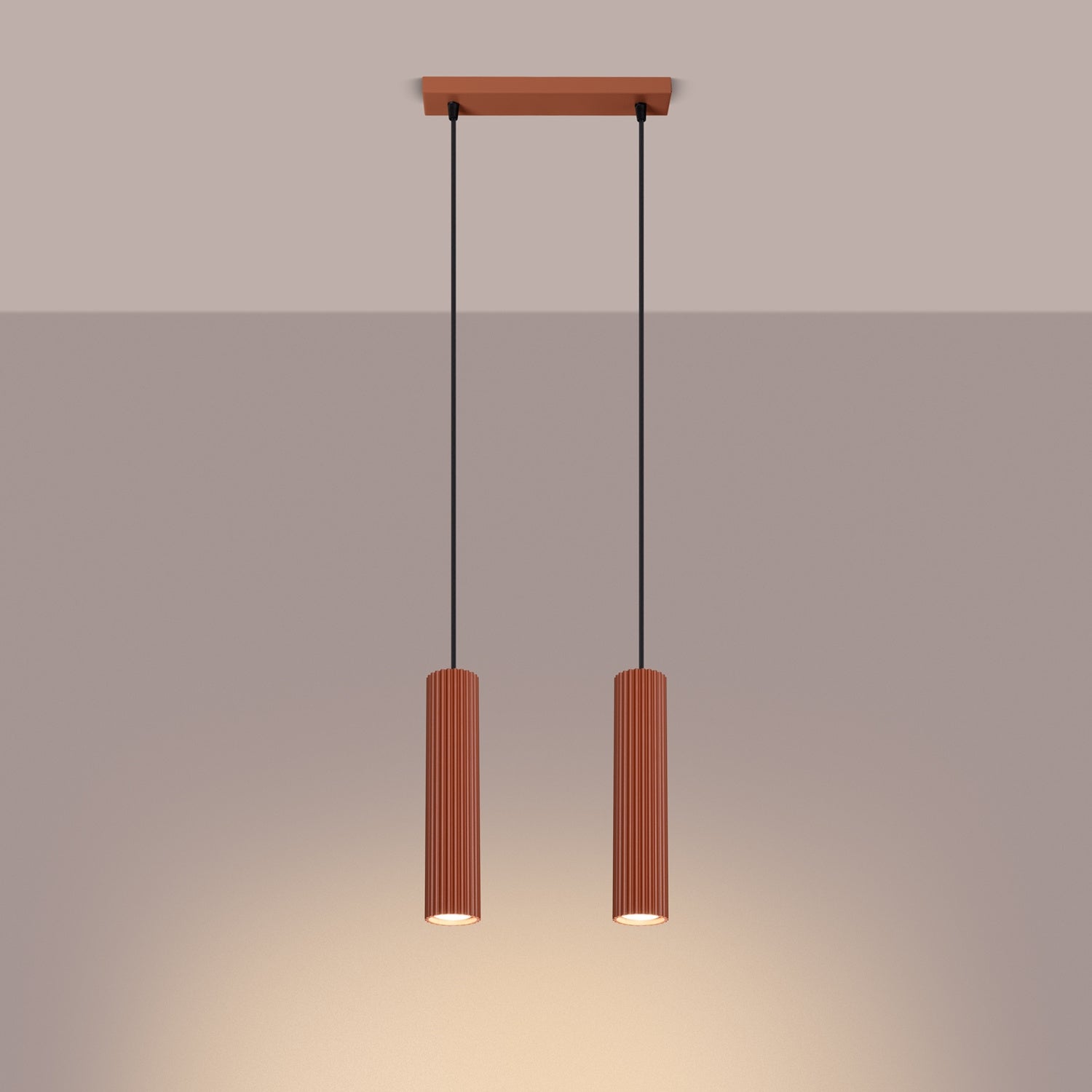Red Ochre Twin Ribbed Pendant Spotlight switched on in modern UK home interior, warm LED glow