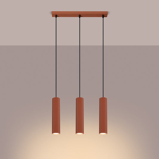 Red Ochre Triple Ribbed Pendant Bar switched on in modern UK home interior, warm LED glow