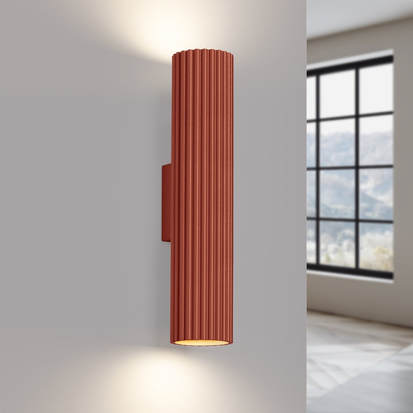 Red Ochre Twin Ribbed Wall Light Up Down switched on in modern UK home interior, warm LED glow