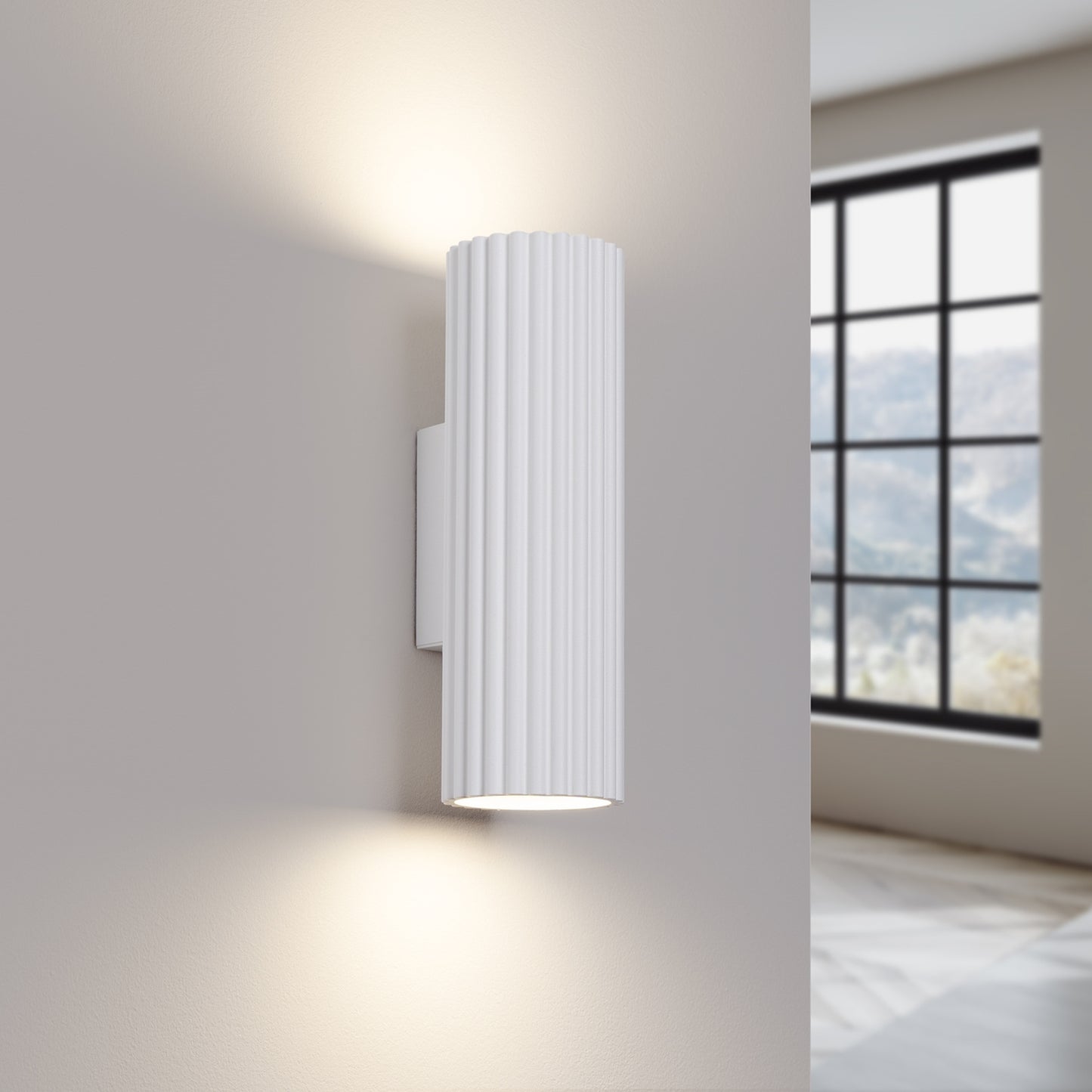 White Ribbed Up Down Wall Light switched on in modern UK home interior, warm LED glow