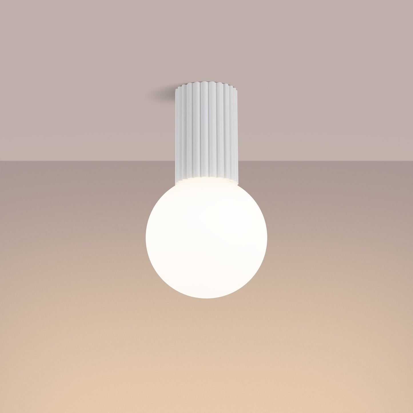 White Opal Glass Globe Ceiling Light IP44 switched on in modern UK home interior, warm LED glow