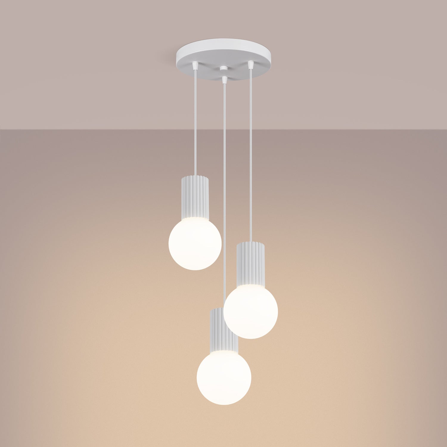White Triple Glass Globe Pendant Cluster switched on in modern UK home interior, warm LED glow