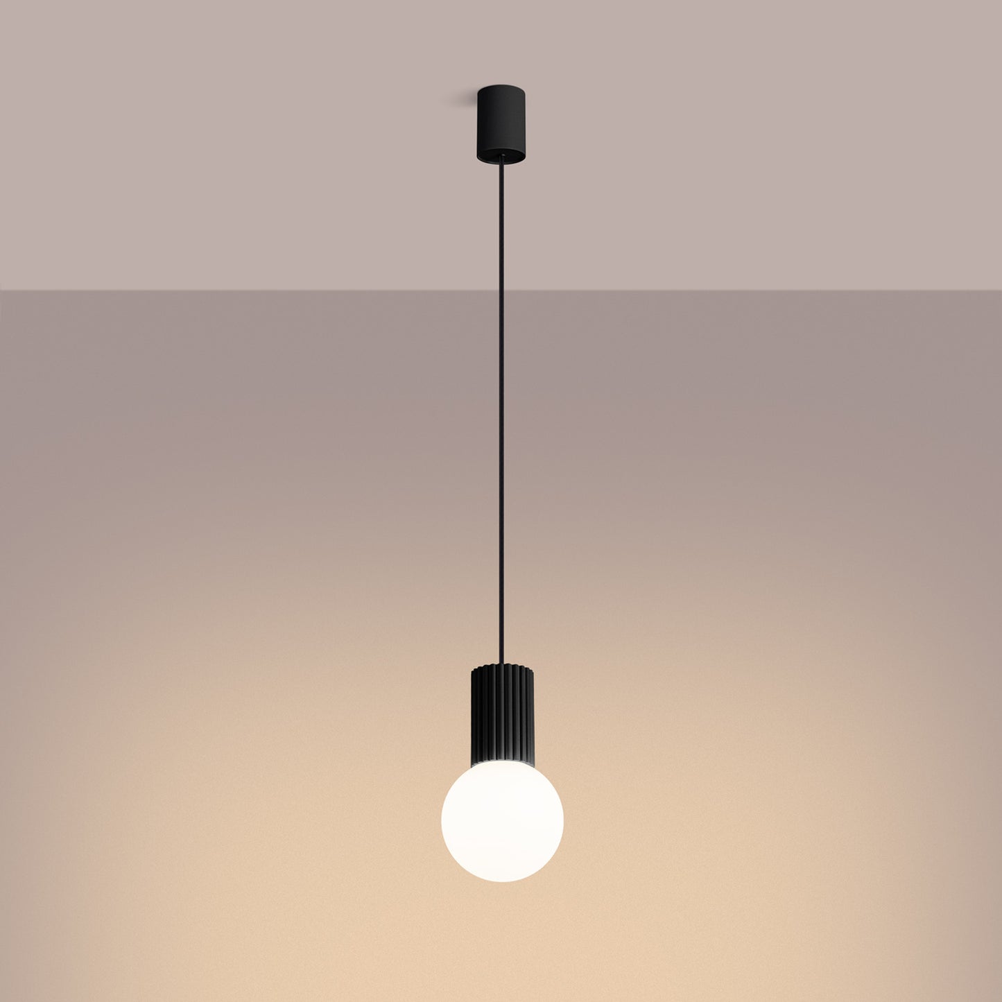 Black Opal Glass Globe Pendant Light switched on in modern UK home interior, warm LED glow