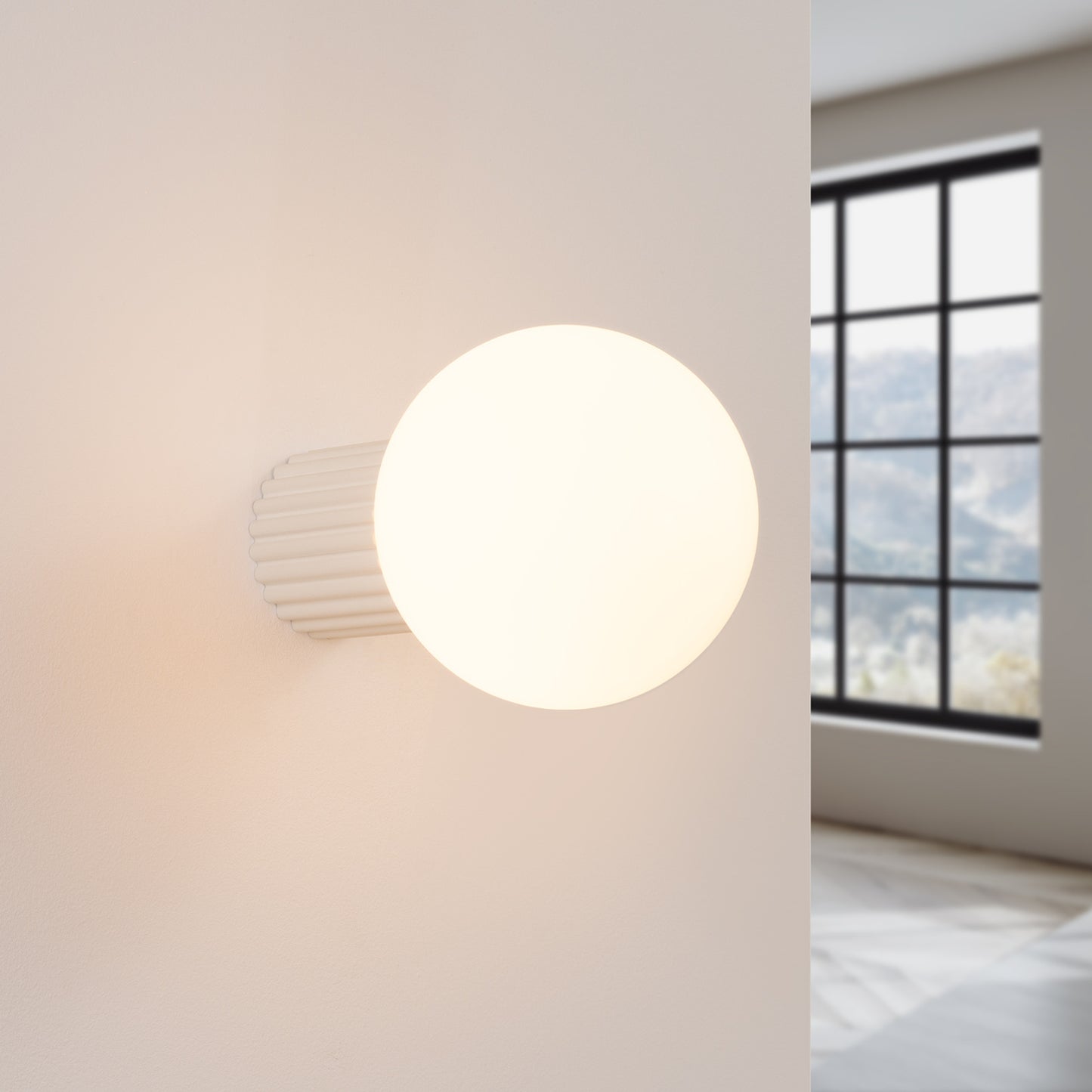 Beige Opal Glass Globe Wall Light IP44 switched on in modern UK home interior, warm LED glow