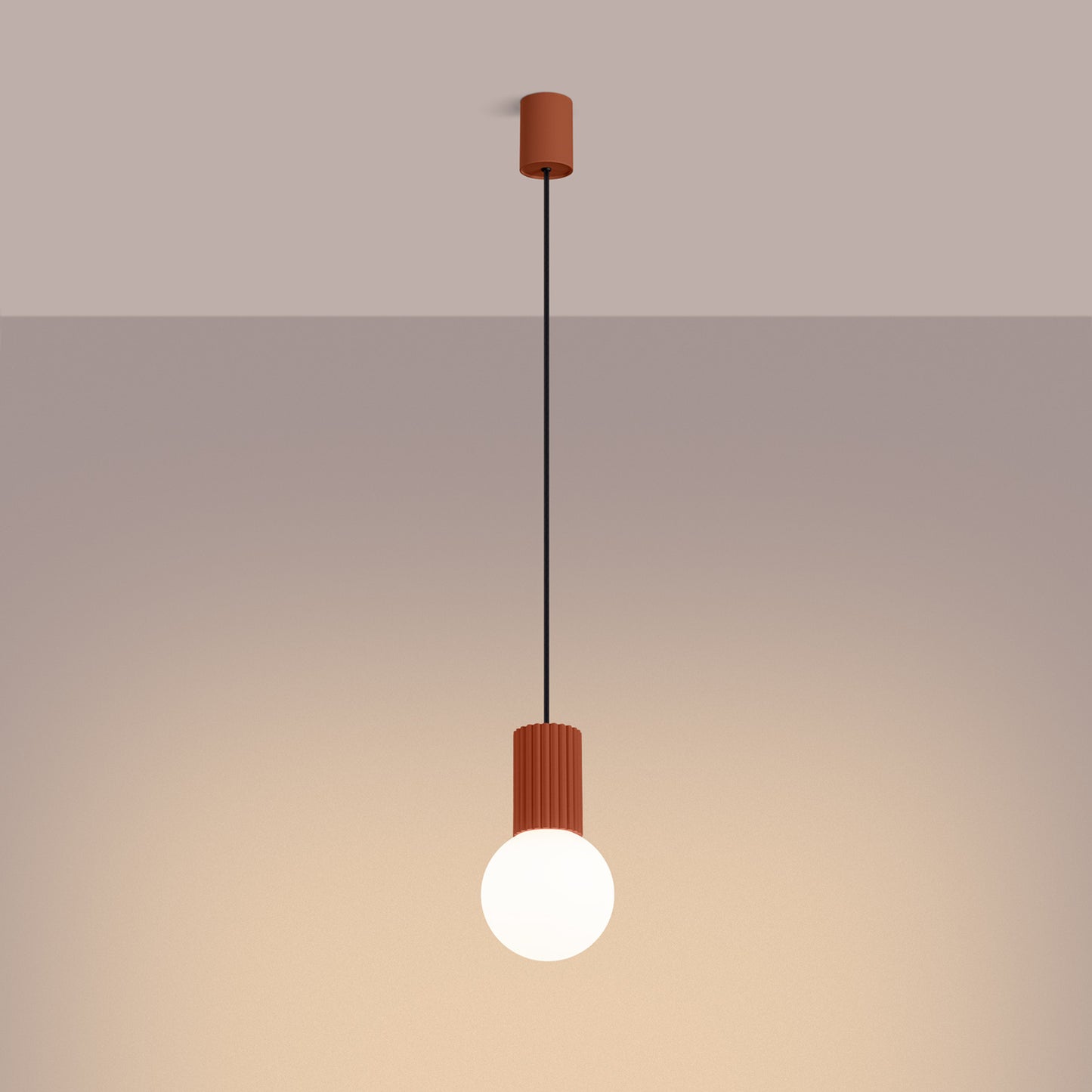 Red Ochre Opal Glass Globe Pendant Light switched on in modern UK home interior, warm LED glow