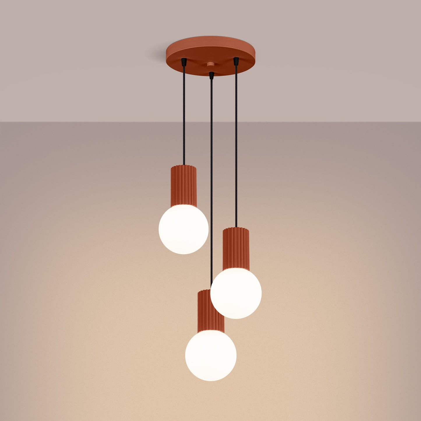 Red Ochre Triple Glass Globe Pendant Cluster switched on in modern UK home interior, warm LED glow