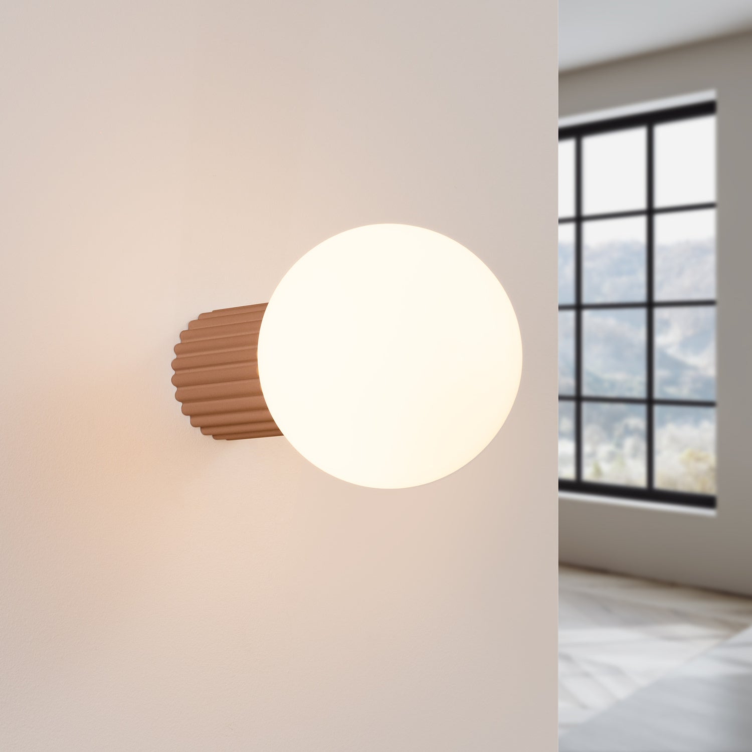 Mocha Opal Glass Globe Wall Light IP44 switched on in modern UK home interior, warm LED glow