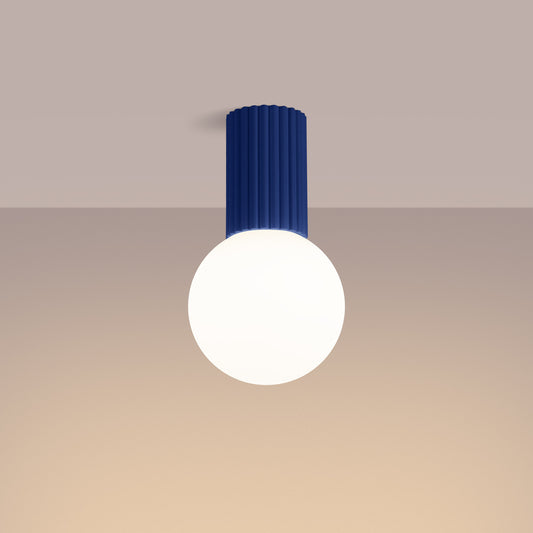 Ultramarine Opal Glass Globe Ceiling Light IP44 switched on in modern UK home interior, warm LED glow