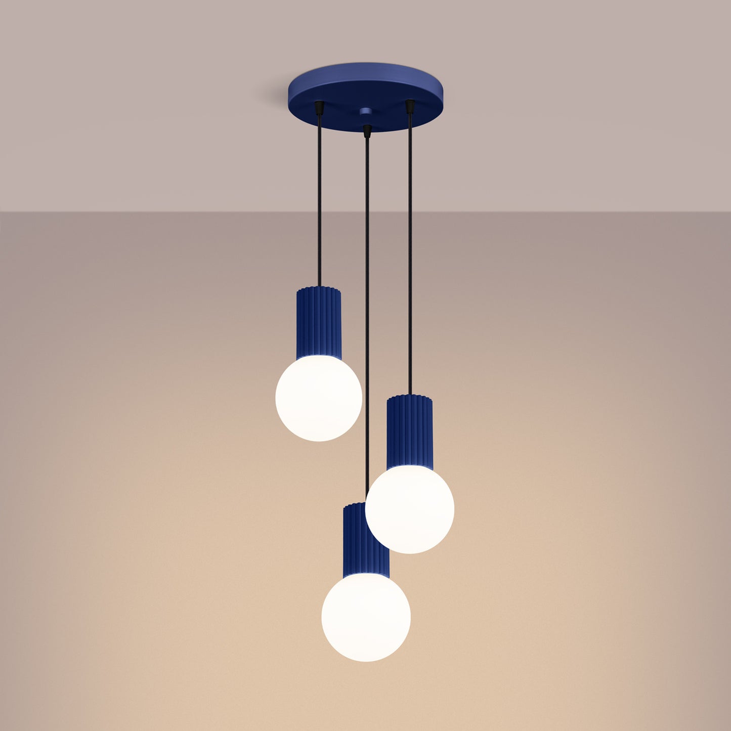 Ultramarine Triple Glass Globe Pendant Cluster switched on in modern UK home interior, warm LED glow