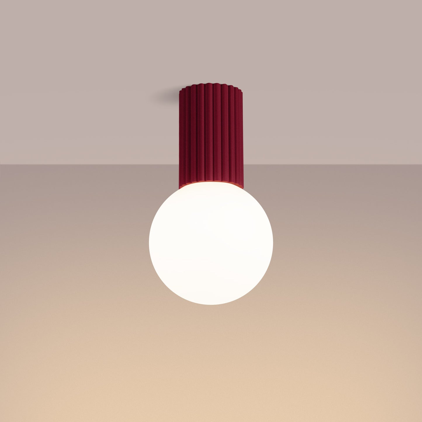Burgundy Opal Glass Globe Ceiling Light IP44 switched on in modern UK home interior, warm LED glow