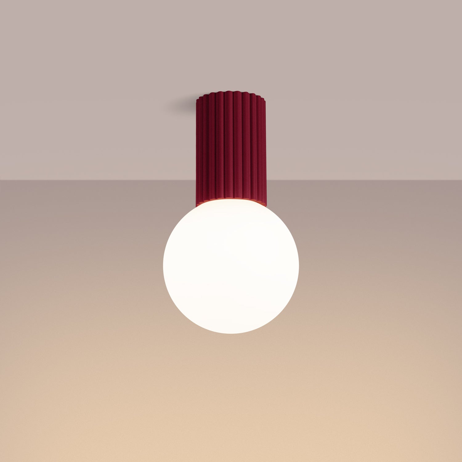 Burgundy Opal Glass Globe Ceiling Light IP44 switched on in modern UK home interior, warm LED glow