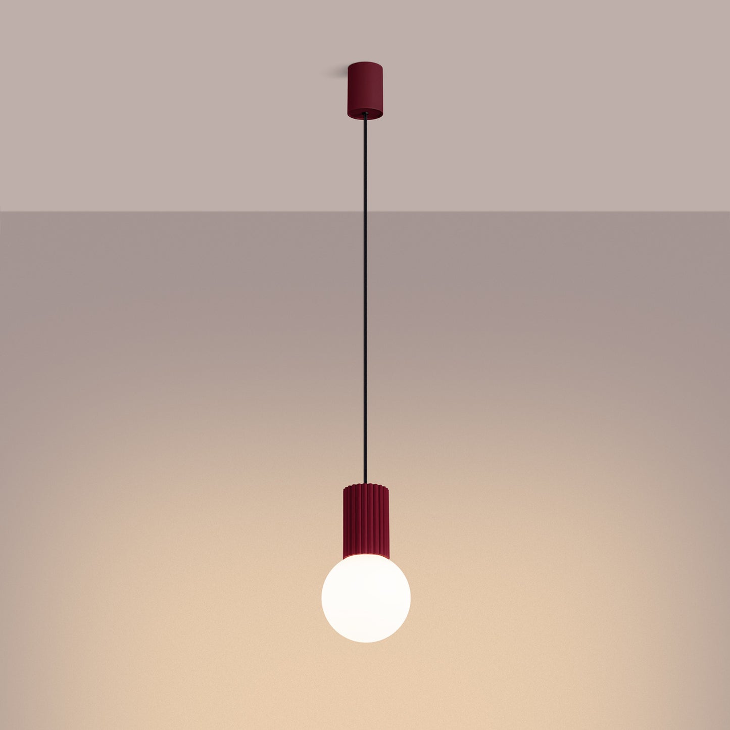Burgundy Opal Glass Globe Pendant Light switched on in modern UK home interior, warm LED glow